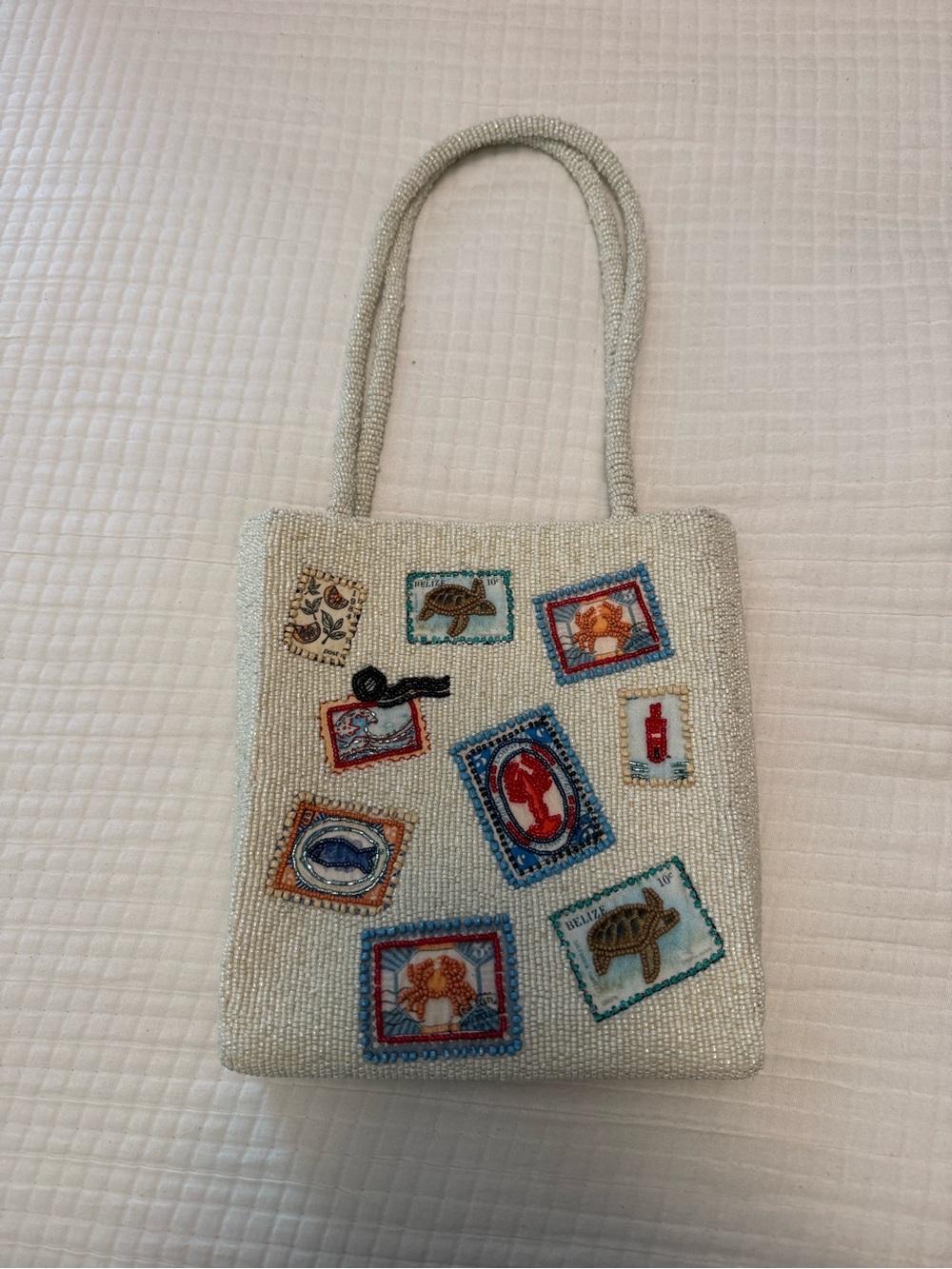 Beaded Cream Tote with Colorful Stamp Motif